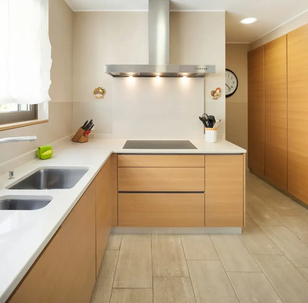 An apartment kitchen shown in pristine condition after being cleaned by Sparkle n' Clean.